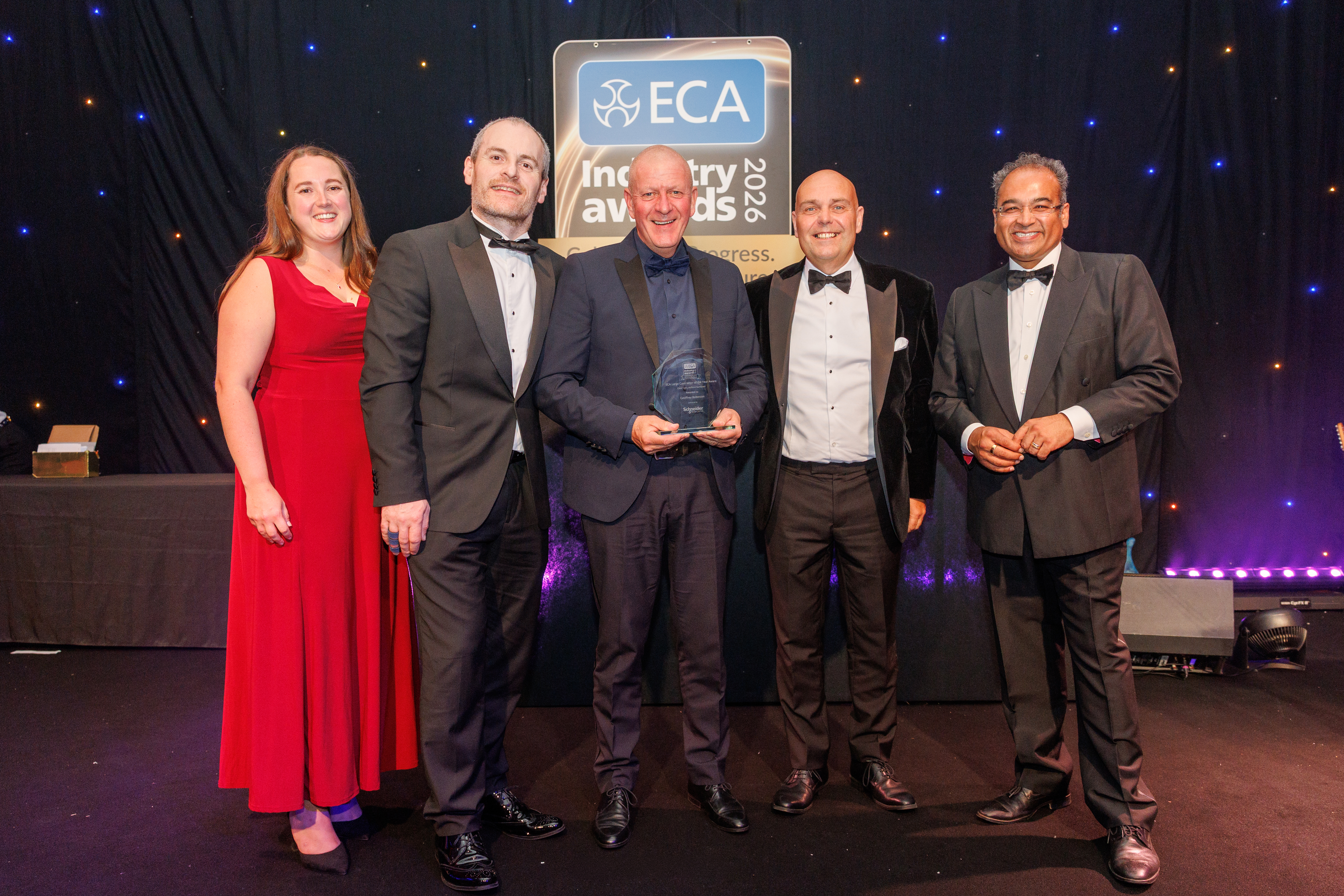 Geoffrey Robinson colleagues presented on stage with the ECA Large Contractor of the Year award
